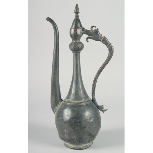 369 - A 16TH CENTURY SAFAVID TINNED COPPER EWER, with hinged lid and curved handle terminating in an open-... 