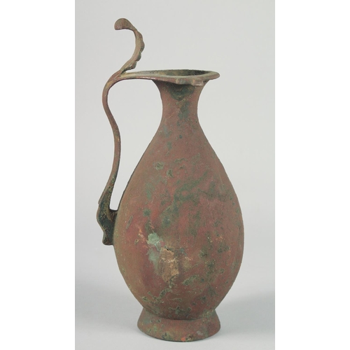 370 - AN EARLY ABBASID OR UMAYYAD EWER, 32.5cm high.