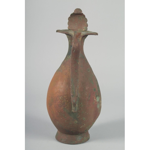 370 - AN EARLY ABBASID OR UMAYYAD EWER, 32.5cm high.