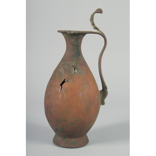 370 - AN EARLY ABBASID OR UMAYYAD EWER, 32.5cm high.