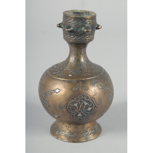 371 - AN EARLY SELJUK SILVER INLAID BOTTLE, possibly 13th century, 12cm high.