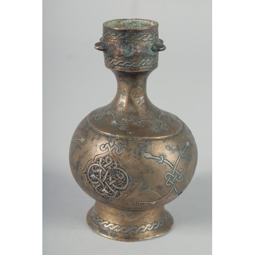 371 - AN EARLY SELJUK SILVER INLAID BOTTLE, possibly 13th century, 12cm high.