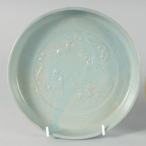 40 - A COLLECTION OF CHINESE GLAZED POTTERY DISHES, comprising two celadon circular dishes and one blue g... 