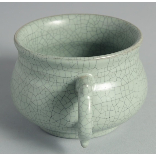 44 - A CHINESE CELADON TWIN HANDLE CENSER, 15cm wide (handle to handle).