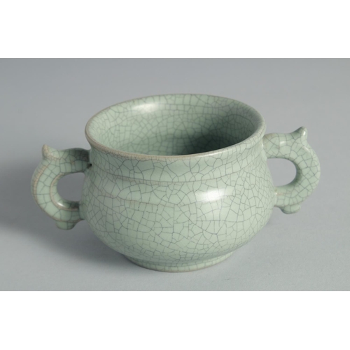 44 - A CHINESE CELADON TWIN HANDLE CENSER, 15cm wide (handle to handle).