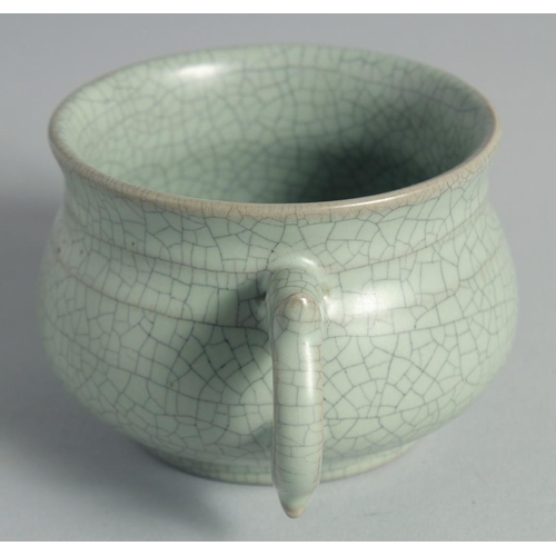 44 - A CHINESE CELADON TWIN HANDLE CENSER, 15cm wide (handle to handle).