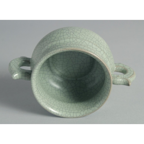 44 - A CHINESE CELADON TWIN HANDLE CENSER, 15cm wide (handle to handle).