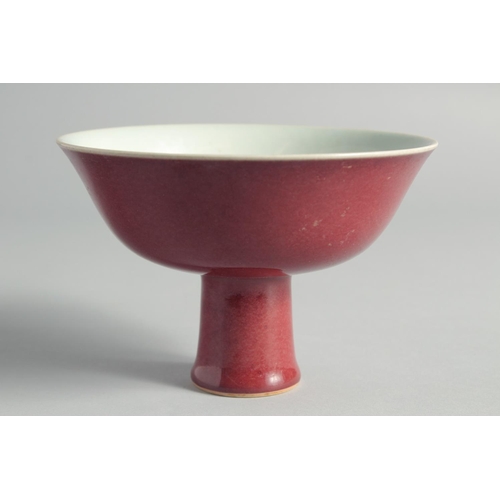 45 - A CHINESE RED GLAZE PEDESTAL BOWL, with six-character mark to inner foot rim, bowl 15cm diameter.