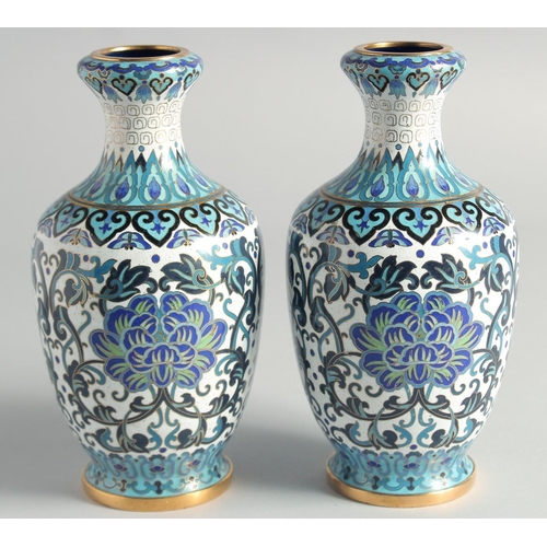 5 - A GOOD PAIR OF BLUE, WHITE AND GREEN CLOISONNE VASES, decorated with intertwined foliate design with... 