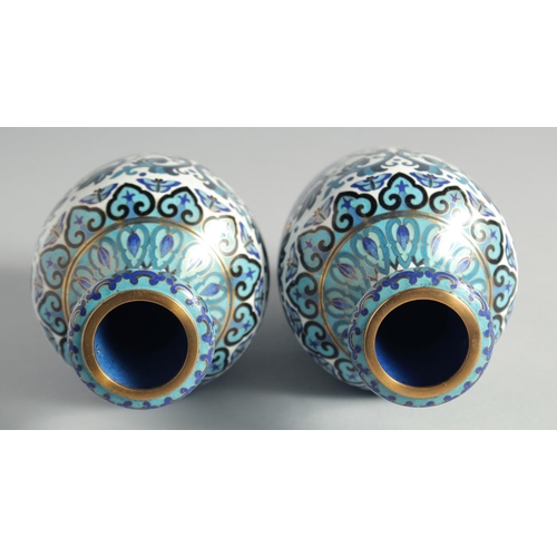 5 - A GOOD PAIR OF BLUE, WHITE AND GREEN CLOISONNE VASES, decorated with intertwined foliate design with... 