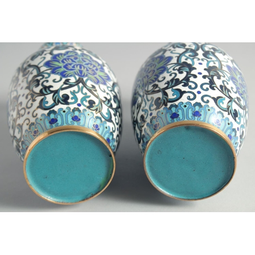 5 - A GOOD PAIR OF BLUE, WHITE AND GREEN CLOISONNE VASES, decorated with intertwined foliate design with... 