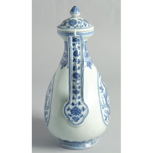 51 - A CHINESE MING STYLE BLUE AND WHITE PORCELAIN LIDDED EWER, decorated with dragons, 27cm high.