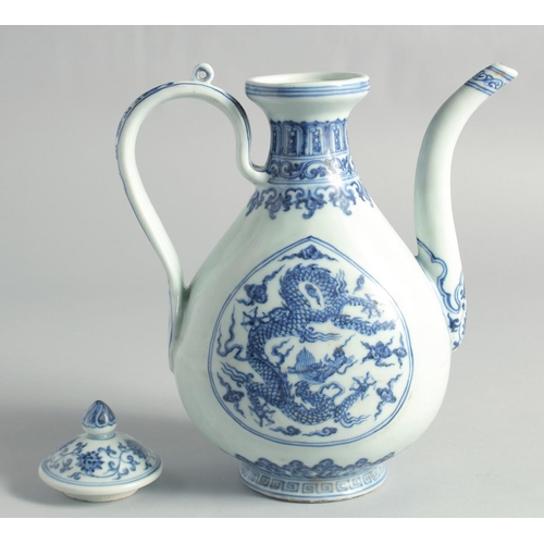 51 - A CHINESE MING STYLE BLUE AND WHITE PORCELAIN LIDDED EWER, decorated with dragons, 27cm high.