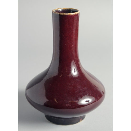 52 - A CHINESE FLAMBE GLAZED BOTTLE VASE, 21cm high.