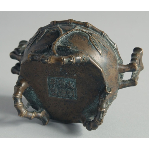 54 - A SMALL CHINESE BRONZE CENSER, with bamboo formed handles and feet, the base with Xuande mark, 12cm ... 