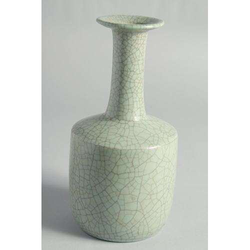 55 - A CHINESE CRACKLE GLAZED CELADON BOTTLE VASE, 23.5cm high.