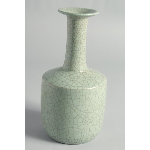 55 - A CHINESE CRACKLE GLAZED CELADON BOTTLE VASE, 23.5cm high.