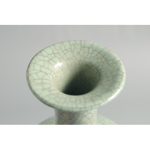 55 - A CHINESE CRACKLE GLAZED CELADON BOTTLE VASE, 23.5cm high.