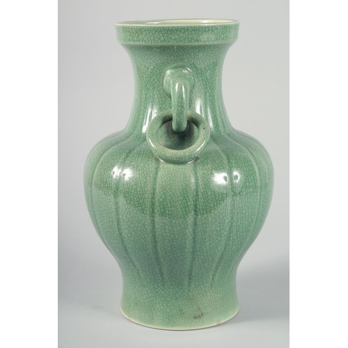 60 - A LARGE CHINESE CELADON CRACKLE GLAZE VASE, with ribbed body and moulded drop ring handles, 30.5cm h... 