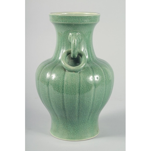 60 - A LARGE CHINESE CELADON CRACKLE GLAZE VASE, with ribbed body and moulded drop ring handles, 30.5cm h... 