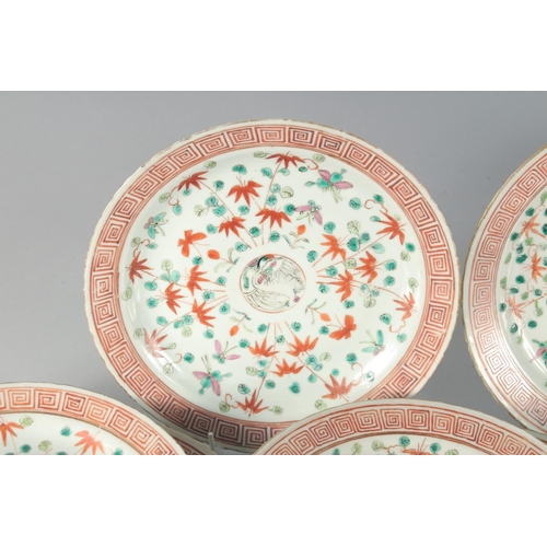 63 - A COLLECTION OF ELEVEN CHINESE FAMILLE VERTE PORCELAIN PLATES, each painted with a central roundel c... 