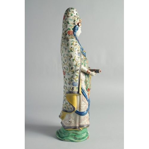 64 - A CHINESE FAMILLE VERTE PORCELAIN FIGURE OF GUANYIN, (af), 49cm high.