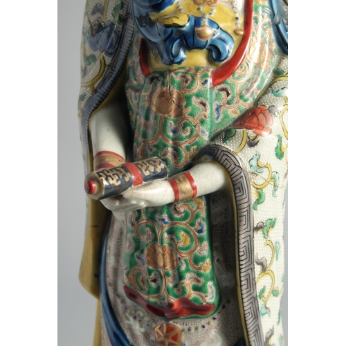 64 - A CHINESE FAMILLE VERTE PORCELAIN FIGURE OF GUANYIN, (af), 49cm high.