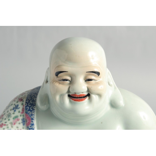 65 - A LARGE CHINESE FAMILLE ROSE PORCELAIN BUDDHA, 25.5cm high.