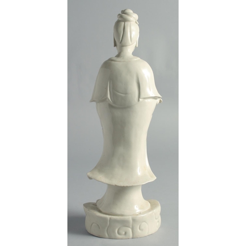 66 - A BLANC-DE-CHINE PORCELAIN FIGURE OF GUANYIN, holding a ruyi scepter, 37cm high.