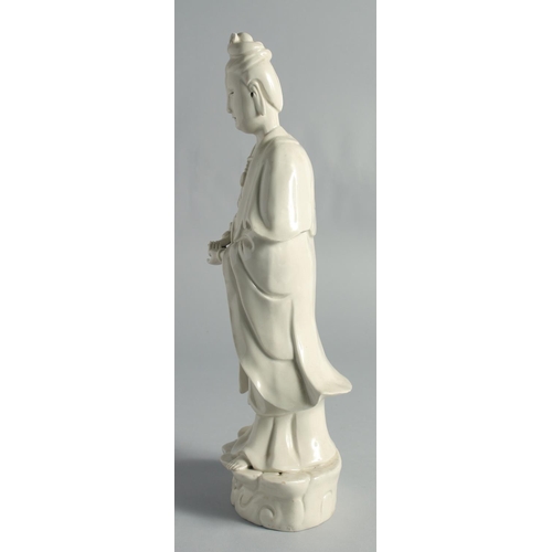 66 - A BLANC-DE-CHINE PORCELAIN FIGURE OF GUANYIN, holding a ruyi scepter, 37cm high.