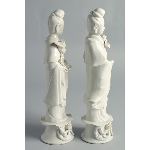 67 - A PAIR OF BLANC-DE-CHINE PORCELAIN FIGURES OF GUANYIN, 31.5cm high.