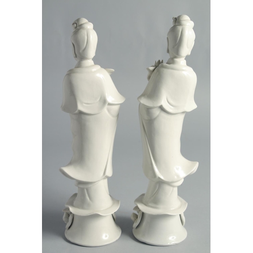 67 - A PAIR OF BLANC-DE-CHINE PORCELAIN FIGURES OF GUANYIN, 31.5cm high.