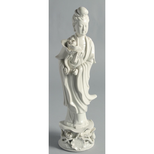 67 - A PAIR OF BLANC-DE-CHINE PORCELAIN FIGURES OF GUANYIN, 31.5cm high.