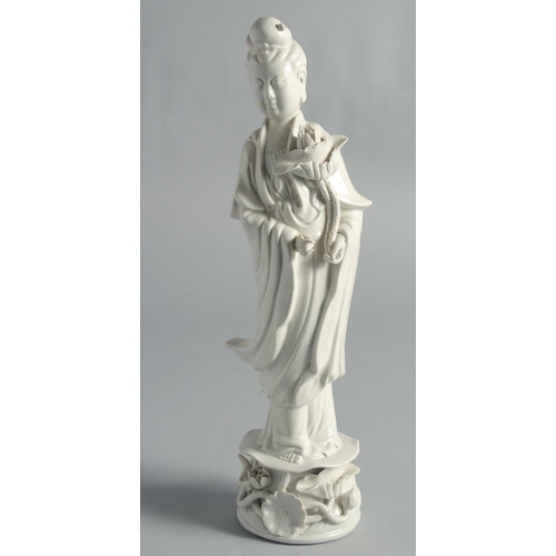 67 - A PAIR OF BLANC-DE-CHINE PORCELAIN FIGURES OF GUANYIN, 31.5cm high.