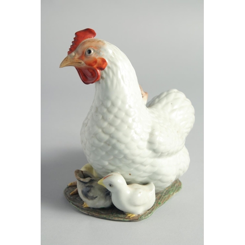 69 - A CHINESE PORCELAIN FIGURAL GROUP, of a cockerel and chicks, character mark to base, (one chick dama... 