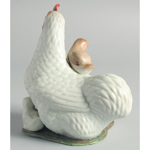 69 - A CHINESE PORCELAIN FIGURAL GROUP, of a cockerel and chicks, character mark to base, (one chick dama... 