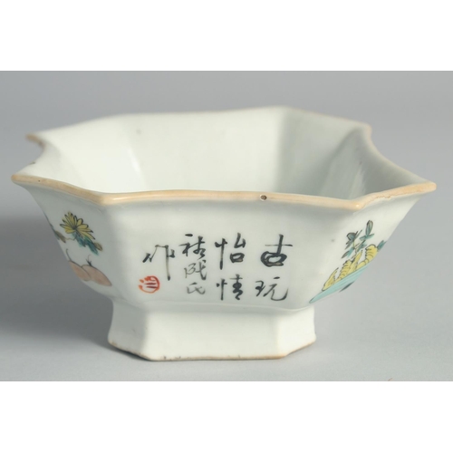 70 - A CHINESE FAMILLE ROSE PORCELAIN OCTAGONAL BOWL, painted with flower pots and inscription.