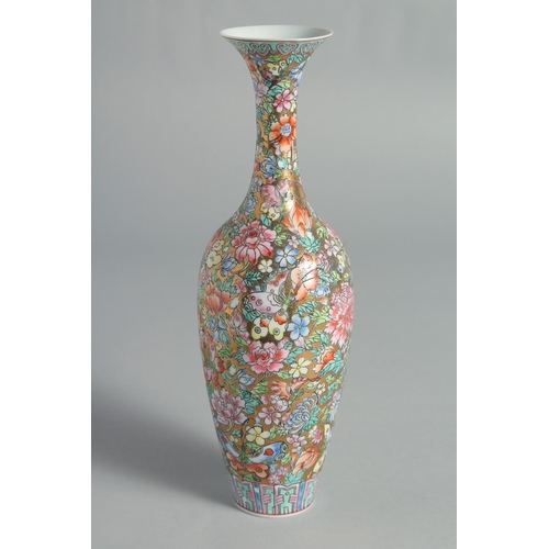 71 - TWO CHINESE FAMILLE ROSE EGGSHELL PORCELAIN VASES, each decorated all over with flowers, (2).