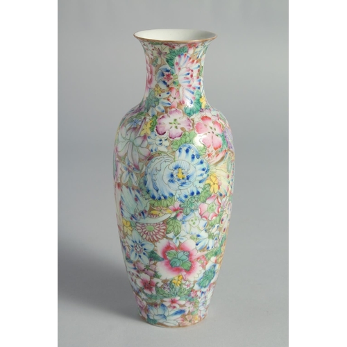 71 - TWO CHINESE FAMILLE ROSE EGGSHELL PORCELAIN VASES, each decorated all over with flowers, (2).