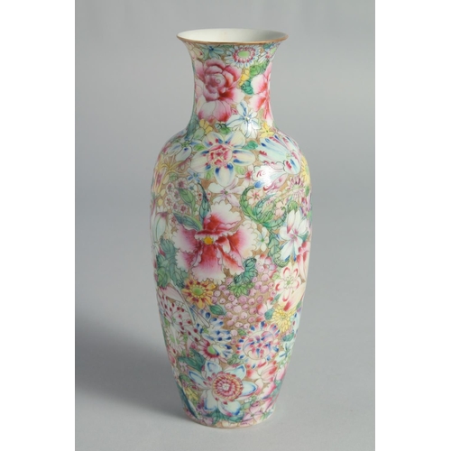 71 - TWO CHINESE FAMILLE ROSE EGGSHELL PORCELAIN VASES, each decorated all over with flowers, (2).