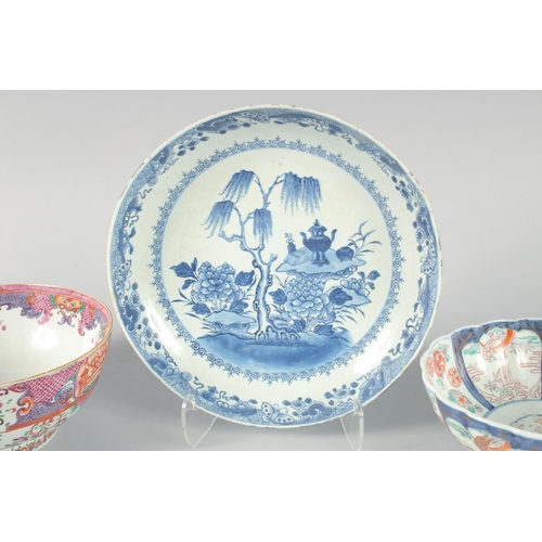 74 - A COLLECTION OF FOUR PORCELAIN ITEMS, including three bowls and a blue and white dish, (af), (4).