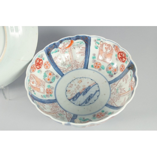 74 - A COLLECTION OF FOUR PORCELAIN ITEMS, including three bowls and a blue and white dish, (af), (4).