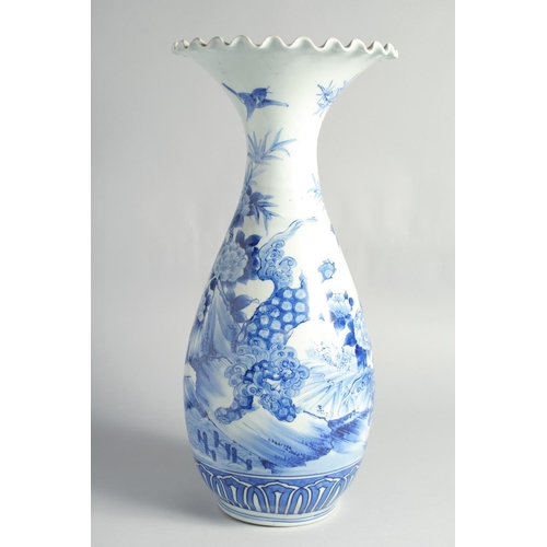 75 - A LARGE JAPANESE BLUE AND WHITE PORCELAIN VASE, painted with flowers, the base with character mark, ... 