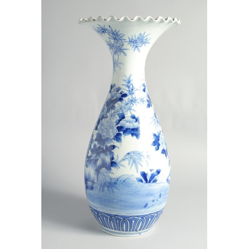 75 - A LARGE JAPANESE BLUE AND WHITE PORCELAIN VASE, painted with flowers, the base with character mark, ... 