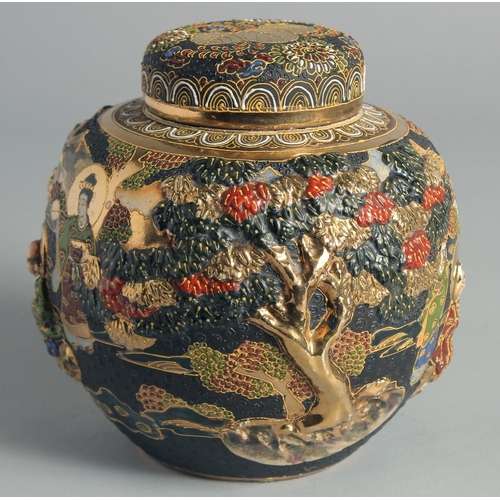 83 - A JAPANESE SATSUMA JAR AND COVER, relief decorated with figures in a landscape scene and further emb... 