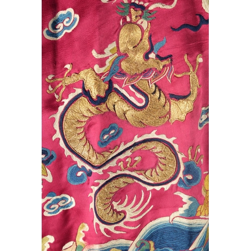 94 - A CHINESE EMBROIDERED SILK JACKET, with embroidered dragons and phoenix.