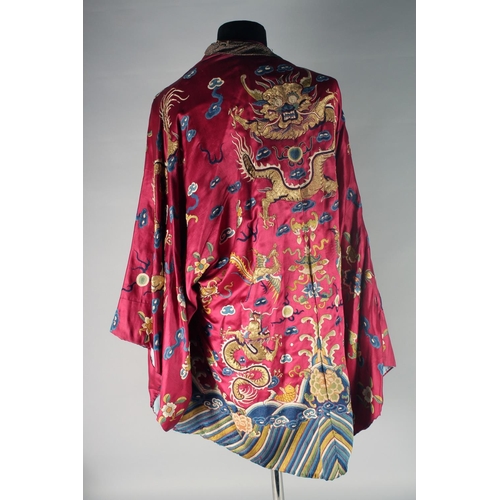 94 - A CHINESE EMBROIDERED SILK JACKET, with embroidered dragons and phoenix.