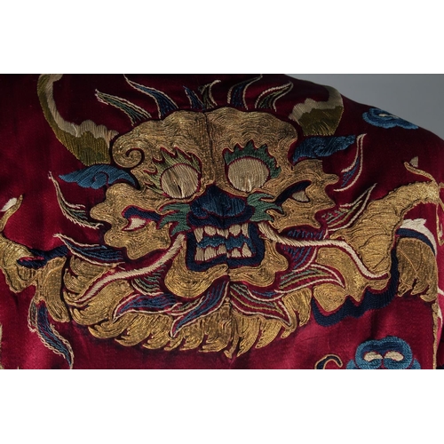 94 - A CHINESE EMBROIDERED SILK JACKET, with embroidered dragons and phoenix.