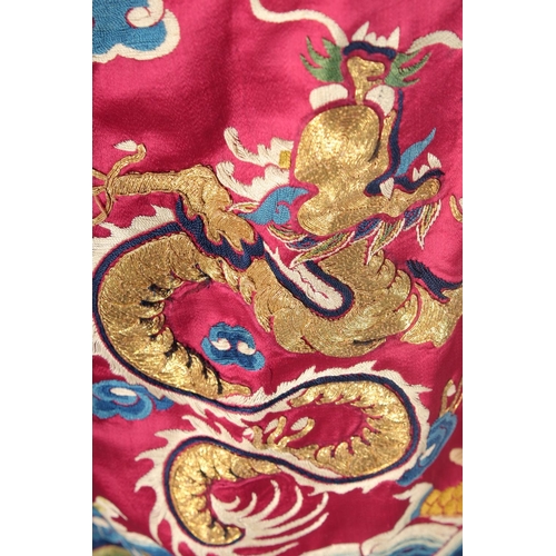 94 - A CHINESE EMBROIDERED SILK JACKET, with embroidered dragons and phoenix.