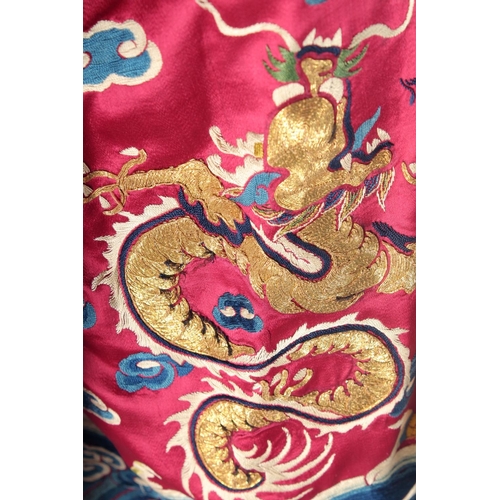 94 - A CHINESE EMBROIDERED SILK JACKET, with embroidered dragons and phoenix.